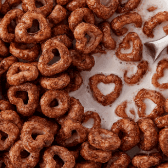 Instagram post featuring a heart-shaped Cheerio in milk for Valentine's Day. - Link to social post